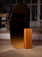 A custom-designed mirror paired with a Natural Wood base